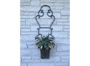 A Wrought Iron Wall Hanging Plant Stand And Copper Insert