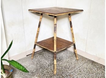 An Antique Tortoise Rattan Occasional Table With Shelf Beneath