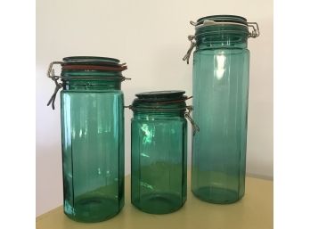 Three Green Tall Canisters