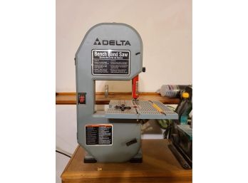 Grizzley Industrial Combination Sander And Delta Bench Band Saw On A Work Bench