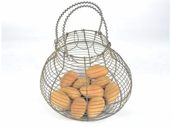Shapely Antique Wire Egg Basket And Faux Eggs