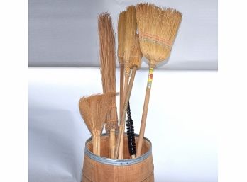 Old Barrel Full Of Handmade Straw Brooms