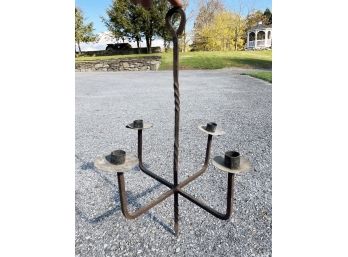 A Wrought Iron Candle Chandelier