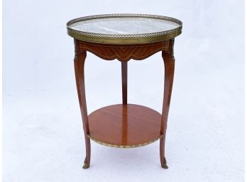 An Inlaid Marquetry Side Table With Ormolu Details And A Marble Top