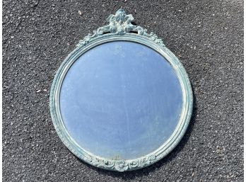 An Ornately Framed Antique Mirror