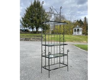 A Vintage Wrought Iron Bakers Rack With Glass Shelves