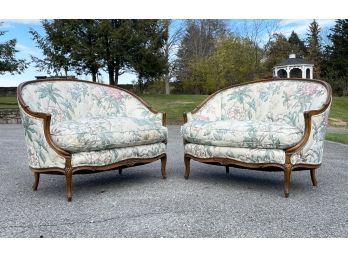 A Pair Of Louis XV Upholstered Causeuses In Cheerful Chintz Print