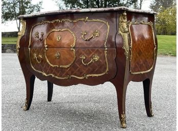 A 19th Century Bombe Form Commode With Onyx Top And Ormolu Trim