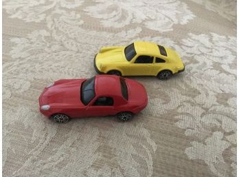 Two Sports Cars - One Red And One Yellow