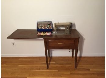 Signature Sewing Machine And Table With A Box Of Accessories