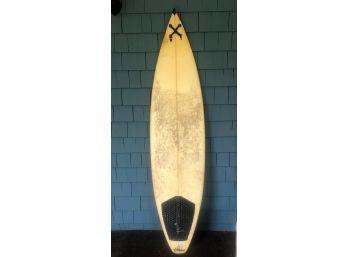 6'  SURFBOARD BY XANADU WITH THREE SOFT FINS. USED BUT IN GENERALLY GOOD CONDITION.