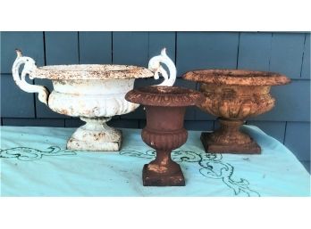 THREE SMALL CAST IRON URNS