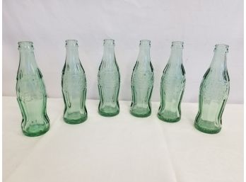 Six Vintage Green Glass Coca Cola Bottles