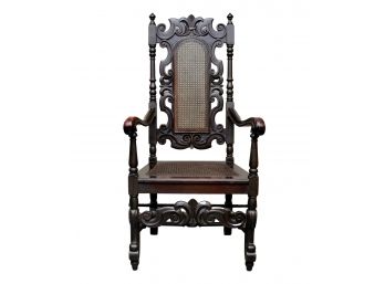 Jacobean Ebony  Carved Arm Chair With Caned Back And Seat