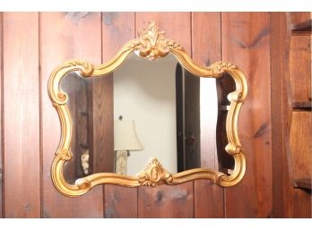 A Gilt Frame Wall Mirror With Scroll Work