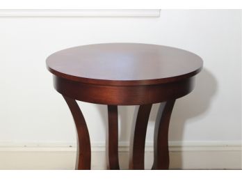 Round Wooden Accent Table With Curved Detailing