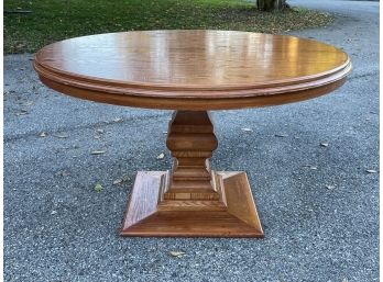 A Round Oak Pedestal Base Dining Table (With Two Leaves!)