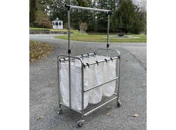 A Metal Laundry Cart With Canvas Inserts