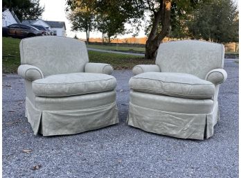 A Pair Of Upholstered Arm Chairs On Swivel Bases By Edward Ferrell