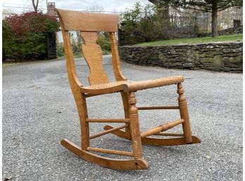 An Antique Cane Seated Rocking Chair