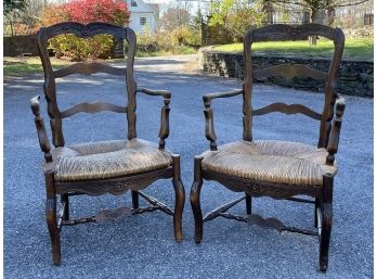 A Pair Of Rush Seated Arm Chairs