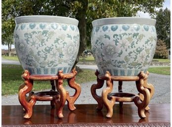 A Pair Of Asian Ceramic Planters On Wood Bases