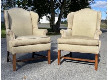 A Pair Of Upholstered Wing Back Chairs