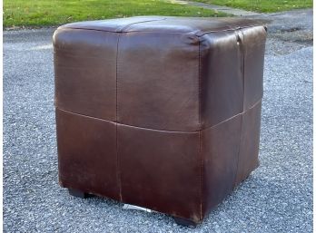 A Leather Ottoman By Mitchell Gold