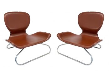 A Pair Of Modern Tawny Leather And Brushed Steel Chairs