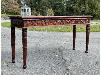 An Early 20th Century Carved Mahogany Console