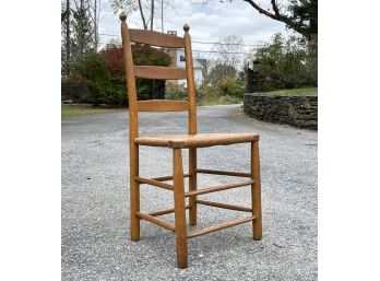 An Antique Shaker Oak Ladder Back Rush Seated Side Chair