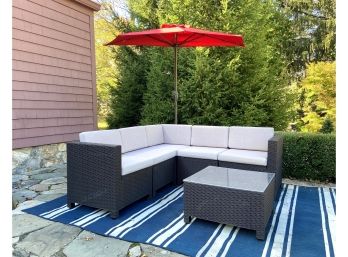 Patio Sectional, Coffee Table, And Sun Umbrella