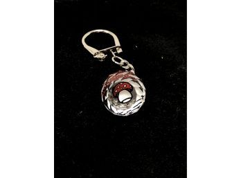 A Crystal Key Ring With A Mushroom Design