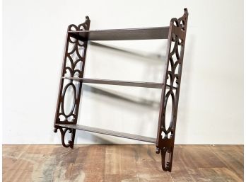 A Scrolled Wood Curio Shelf