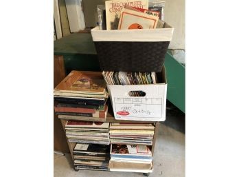 A Record Collection On A Rolling Cart