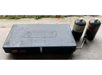 Coleman Propane Stove With Two Half Used Propane Cans