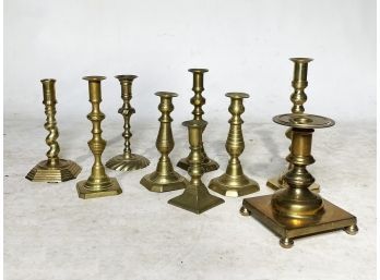 A Large Collection Of Vintage Brass Candlesticks