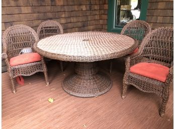 An Outdoor All Weather Wicker Dining Set - 60' Table And 4 Chairs With Pillows And Cushions