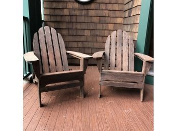 A Pair Of Wood Adirondack Chairs