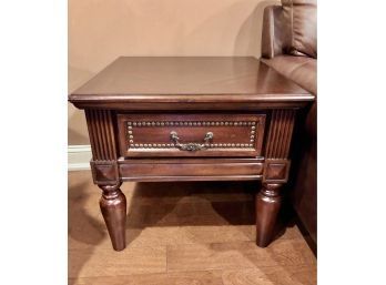 A Pair Of Dark Wood End Tables With A Drawer