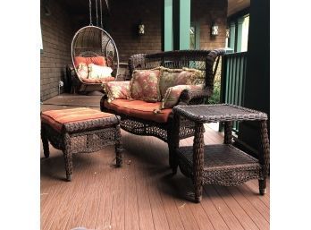 A 3 Piece Outdoor All Weather Wicker Settee, Ottoman And Table