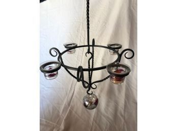 A Hanging Wrought Iron Votive Candle Holder