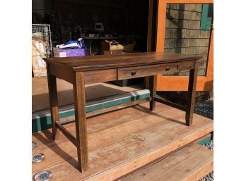 A Dark Stained Wood Desk With Key Board Drawer -