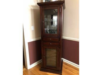 A Wine Cabinet Case With Built In Electric Wine Cooler Below