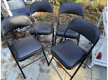 Four Black Folding Chairs