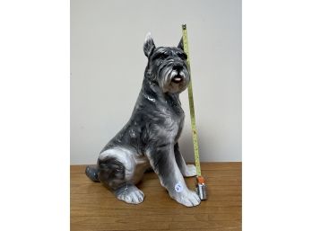 A POTTERY TERRIER DOG SCULPTURE