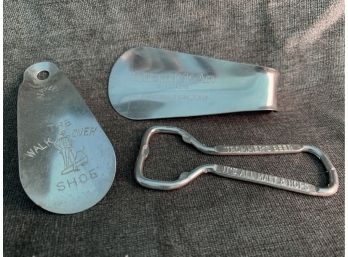 Two Metal Shoe Horns And A Bottle Opener