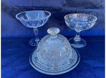 Two Clear Glass Cans Bowls And A Covered Plate