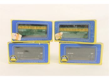 Vintage Group Of Four HO Train Cars From AHM - Chicago & North Western & Rio Grande Cattle Cars