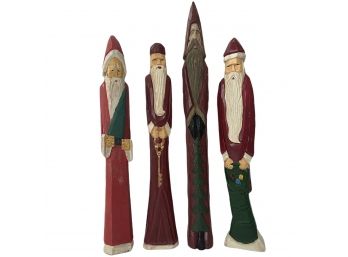 Four Carved Wooden Santas